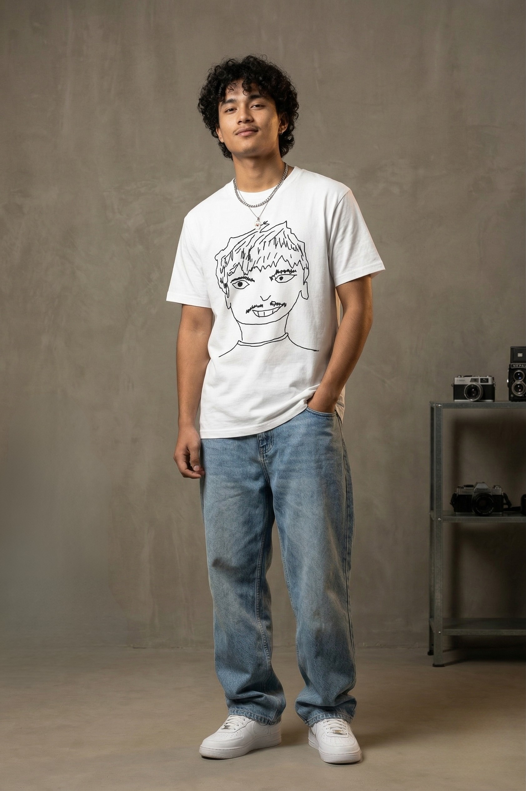 Curly-haired model showcasing oversized fit t-shirt - SKRIBBL SERIES streetwear collection